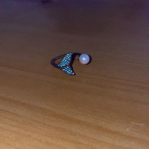 A real pearl blue dolphin ring